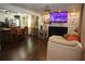 Inviting living room featuring a fireplace, mounted tv, and open access to the kitchen at 3227 Due West Rd, Dallas, GA 30157