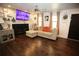 Cozy living room with fireplace, flat-screen television, hardwood floors, and comfortable seating at 3227 Due West Rd, Dallas, GA 30157