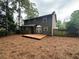 Backyard featuring a wooden deck with a fenced in yard surrounding the back of the house at 525 Cherokee Overlook Ct, Canton, GA 30115