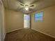 Bedroom featuring neutral paint, carpet flooring, a ceiling fan, and a window at 525 Cherokee Overlook Ct, Canton, GA 30115