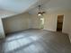 Large bedroom features a carpeted floor, ceiling fan, and views of an ensuite bathroom and closet at 525 Cherokee Overlook Ct, Canton, GA 30115
