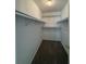 Walk-in closet with carpeted floor at 525 Cherokee Overlook Ct, Canton, GA 30115