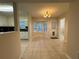 The dining area features tile floors, a chandelier, and large windows that let in plenty of light at 525 Cherokee Overlook Ct, Canton, GA 30115