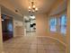The dining area offers an open concept with the kitchen, with warm and inviting natural light at 525 Cherokee Overlook Ct, Canton, GA 30115