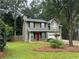 Attractive two-story house with black shutters, green lawn, and an attached two-car garage at 525 Cherokee Overlook Ct, Canton, GA 30115
