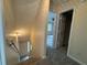 View of the carpeted hallway and stairway leading to the bedrooms in the house at 525 Cherokee Overlook Ct, Canton, GA 30115