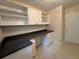 The office offers ample storage and workspace with a built-in desk, drawers, and open shelving at 525 Cherokee Overlook Ct, Canton, GA 30115
