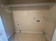 The storage room provides plenty of space for laundry appliances and home storage solutions at 525 Cherokee Overlook Ct, Canton, GA 30115