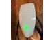 Image of a Tesla Wall Connector EV charger installed on a wall with green light indicating that it's ready to charge at 525 Cherokee Overlook Ct, Canton, GA 30115