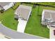 Aerial view of home showcasing its large, manicured lawn, patio, and dark fencing at 6825 Rambling Vale, Cumming, GA 30028