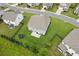 Aerial view of backyard with patio, trampoline, black perimeter fencing, and landscaped lawn at 6825 Rambling Vale, Cumming, GA 30028