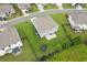 Aerial view of landscaped backyard featuring a patio, trampoline, and dark perimeter fencing at 6825 Rambling Vale, Cumming, GA 30028