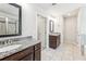 Bathroom featuring double sinks, granite countertops, and a tiled floor at 6825 Rambling Vale, Cumming, GA 30028