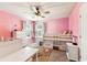 Pink bedroom featuring carpet, ceiling fan, and ample natural light at 6825 Rambling Vale, Cumming, GA 30028