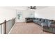 Large bonus room with carpeting, windows, and a large sectional sofa at 6825 Rambling Vale, Cumming, GA 30028
