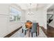 Cozy dining room with coffered ceilings, wainscoting, and views to the stairway at 6825 Rambling Vale, Cumming, GA 30028