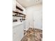 Well-lit laundry room featuring washer, dryer, cabinets and white trim at 6825 Rambling Vale, Cumming, GA 30028