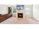 Living room with carpeting, fireplace, built-ins, and a large television at 6825 Rambling Vale, Cumming, GA 30028
