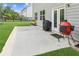 Back patio featuring various outdoor grilling options and view of the lawn at 6825 Rambling Vale, Cumming, GA 30028