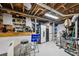 Organized basement utility space with storage solutions and work area at 747 Channing Nw Dr, Atlanta, GA 30318