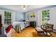 Sunlit bedroom with hardwood floors, ample windows, and comfortable seating at 747 Channing Nw Dr, Atlanta, GA 30318