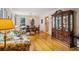 Elegant dining room with hardwood floors, china cabinet, and view of the kitchen at 747 Channing Nw Dr, Atlanta, GA 30318