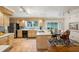 Open-concept kitchen featuring light wood cabinetry, tile floors, and a breakfast nook area at 747 Channing Nw Dr, Atlanta, GA 30318