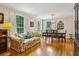 Cozy living room with hardwood floors, natural light, and stylish furnishings including a floral sofa at 747 Channing Nw Dr, Atlanta, GA 30318