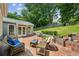 Inviting brick patio with comfortable seating and a tranquil backyard view at 747 Channing Nw Dr, Atlanta, GA 30318