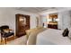 Bedroom with hardwood floors and an en suite bathroom with decorative furnishings at 1676 Grove Park Way, Decatur, GA 30033