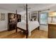 Bedroom featuring a four-poster bed, ceiling fan, and built-in cabinetry at 1676 Grove Park Way, Decatur, GA 30033