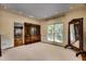 Elegant dining room with a built in china cabinet, hardwood floors, and intricate trim at 1676 Grove Park Way, Decatur, GA 30033