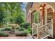 Brick house front yard featuring a fountain, lush bushes, and manicured landscaping at 1676 Grove Park Way, Decatur, GA 30033