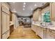 Eat-in kitchen includes stainless appliances, custom cabinets, and marble countertops at 1676 Grove Park Way, Decatur, GA 30033