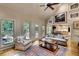 Cozy living room with a vaulted ceiling, fireplace, and access to kitchen and dining area at 1676 Grove Park Way, Decatur, GA 30033