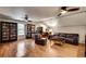 Spacious living room featuring hardwood floors, two ceiling fans, and a leather sofa at 1676 Grove Park Way, Decatur, GA 30033
