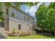 Backyard featuring a small garden, stone steps, and an outdoor dining area at 175 Centennial Trce, Roswell, GA 30076