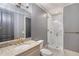 Modern bathroom featuring granite counters, framed mirror, glass enclosed shower, and stylish finishes at 175 Centennial Trce, Roswell, GA 30076