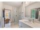 Bright bathroom featuring a glass shower with unique patterned tile and a large single sink vanity at 175 Centennial Trce, Roswell, GA 30076