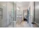 Modern bathroom with glass-enclosed shower, sleek vanity, and neutral tile flooring at 175 Centennial Trce, Roswell, GA 30076