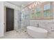 Elegant bathroom featuring a glass shower, soaking tub, and neutral tilework, creating a spa-like retreat at 175 Centennial Trce, Roswell, GA 30076
