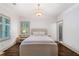 Cozy bedroom with natural light, modern lighting, and a neutral color scheme for a relaxing retreat at 175 Centennial Trce, Roswell, GA 30076