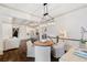 Inviting dining area with stylish light fixture and plantation shutters for a bright, airy atmosphere at 175 Centennial Trce, Roswell, GA 30076