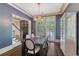 Elegant dining room featuring a stylish chandelier, dark wood table, and tasteful decor, perfect for gatherings at 175 Centennial Trce, Roswell, GA 30076