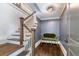 Entryway with staircase, hardwood floors, and a green velvet couch against the wall at 175 Centennial Trce, Roswell, GA 30076