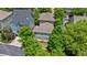 Aerial view of a two-story home surrounded by lush greenery and mature trees in a residential neighborhood at 175 Centennial Trce, Roswell, GA 30076