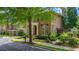 Stately brick home featuring manicured landscaping, a charming entryway, and a well-maintained lawn at 175 Centennial Trce, Roswell, GA 30076