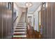Inviting foyer with hardwood floors, elegant staircase, and neutral decor, creating a warm and welcoming atmosphere at 175 Centennial Trce, Roswell, GA 30076