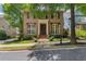 Charming brick home featuring a symmetrical facade, manicured landscaping, and a welcoming front entrance at 175 Centennial Trce, Roswell, GA 30076