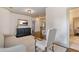 Hallway featuring hardwood floors, neutral walls, and modern lighting that leads into the bedroom at 175 Centennial Trce, Roswell, GA 30076